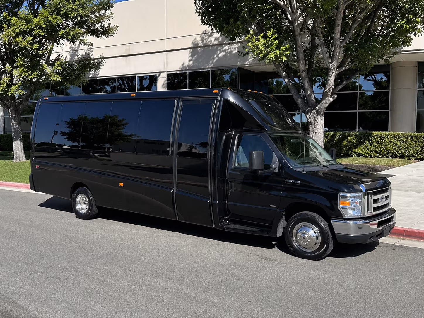Friends laughing during a party bus celebration in Centennial
